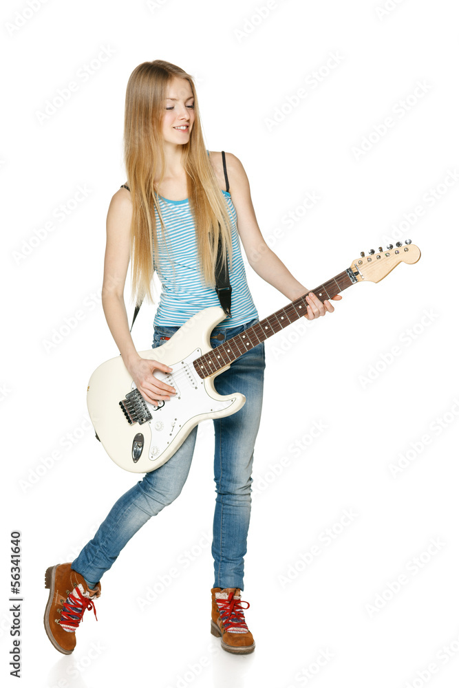 Pretty blond woman playing the guitar in full length Pretty blond woman playing the guitar in full length