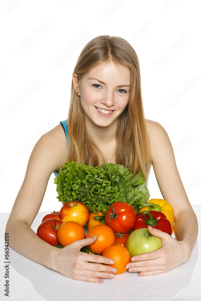 Girl embracing vegetables and fruits Girl embracing vegetables and fruits