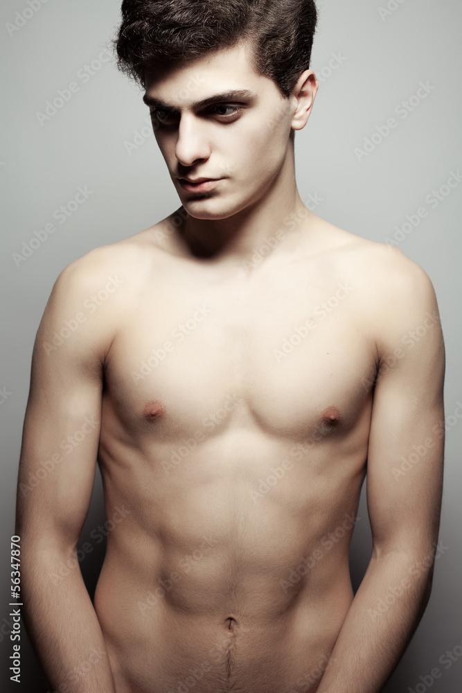 Beautiful (handsome) muscular male model with nice abs posing Beautiful (handsome) muscular male model with nice abs posing