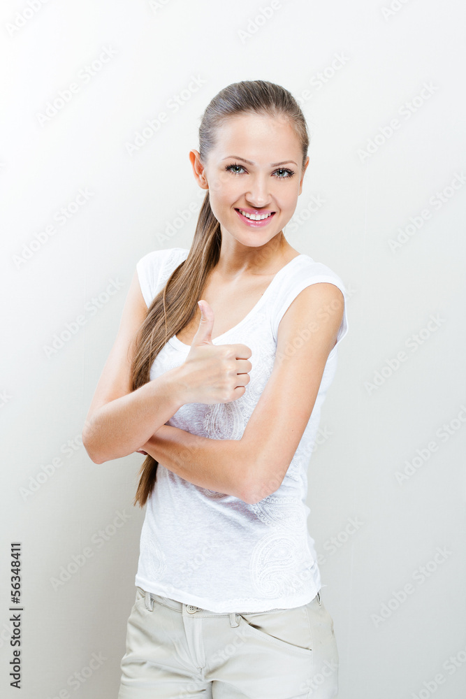 Beautiful smiling business woman standing. Thumbs up. Beautiful smiling business woman standing. Thumbs up.