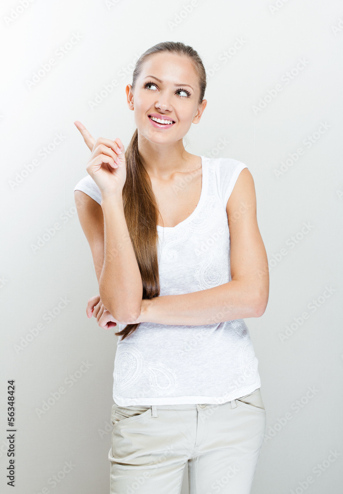 Happy business woman pointing an idea Happy business woman pointing an idea