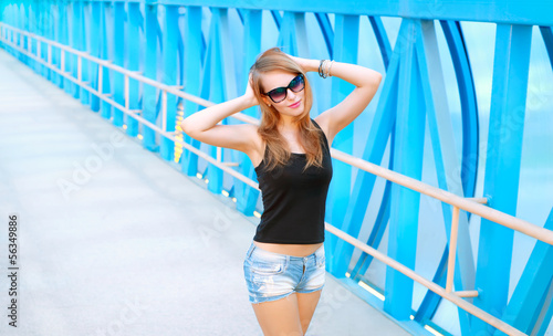 Portrait of a beautiful fashionable girl in sunglasses