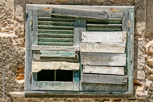 Fotografie Old boarded up window