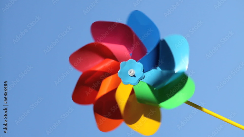One colorful pinwheel over blue sky background, 1080 One colorful pinwheel over blue sky background, 1080