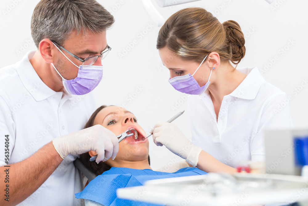 Patient with Dentist - dental treatment Patient with Dentist - dental treatment
