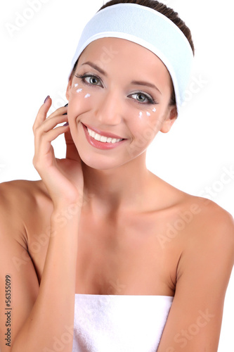 Beautiful girl moisturizing...