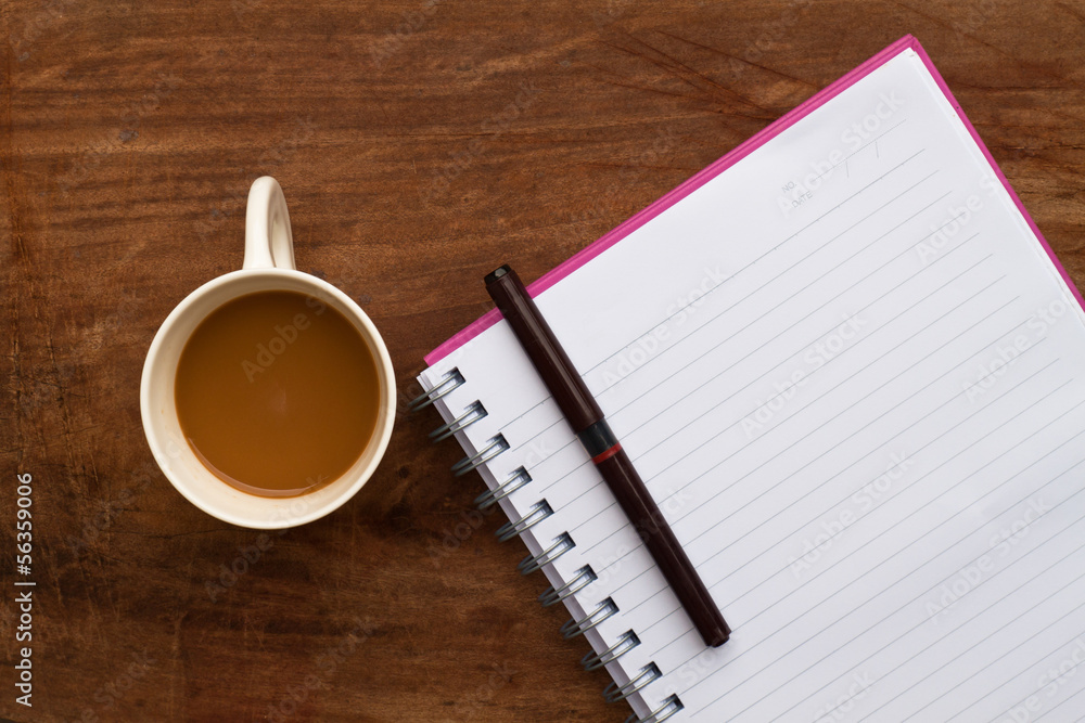 coffee with note and pen  on   wood background