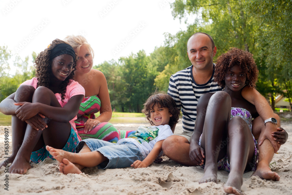 Happy fosterfamily on the beach Happy fosterfamily on the beach