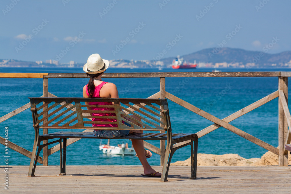 Woman sits on the bench
