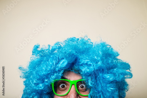 Fototapeta Naklejka Na Ścianę i Meble -  crazy funny bearded man with blue wig