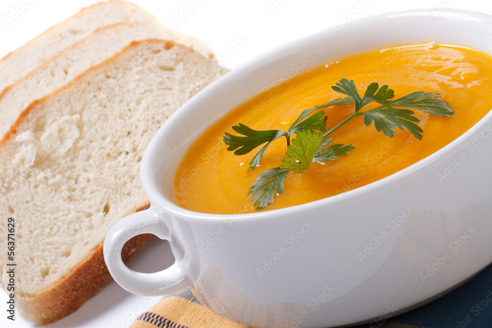 Pumpkin soup with bread isolated on white background Pumpkin soup with bread isolated on white background