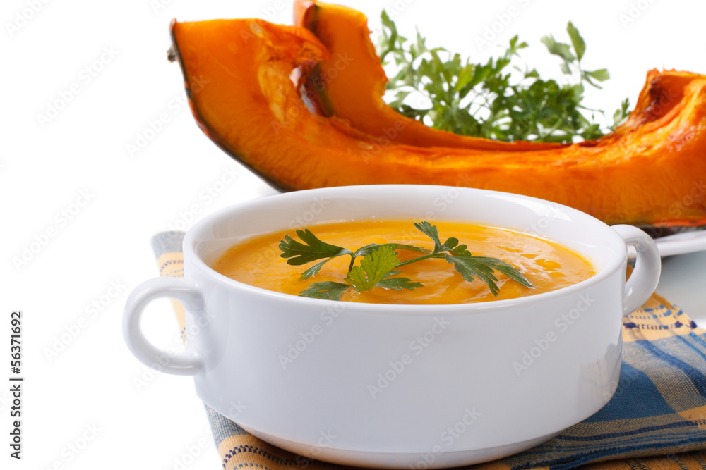 Soup with baked pumpkin and parsley isolated on white background Soup with baked pumpkin and parsley isolated on white background