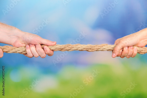 Tug of war, on bright background