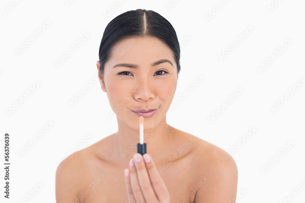 Funny attractive model holding lip gloss Funny attractive model holding lip gloss