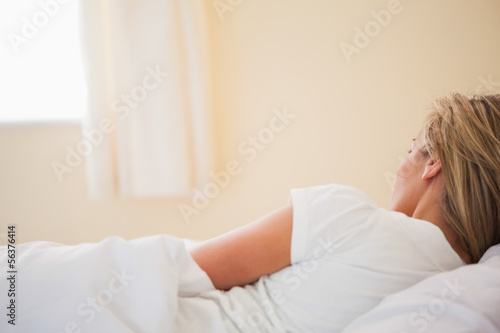 Sleeping woman on her bed