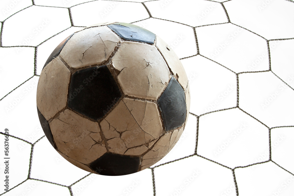 Soccer football in Goal net