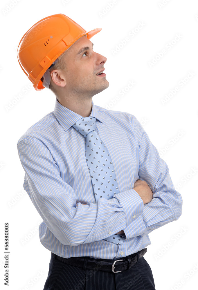 happy young foreman with hard hat looking up happy young foreman with hard hat looking up