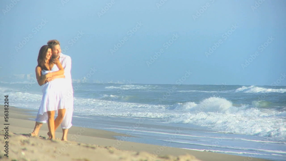 Happy Caucasian Couple Dressed White Enjoying Beach Happy Caucasian Couple Dressed White Enjoying Beach