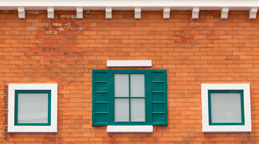 White window on a brick wall