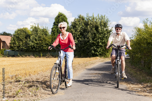 senior couple enjoying bike trip