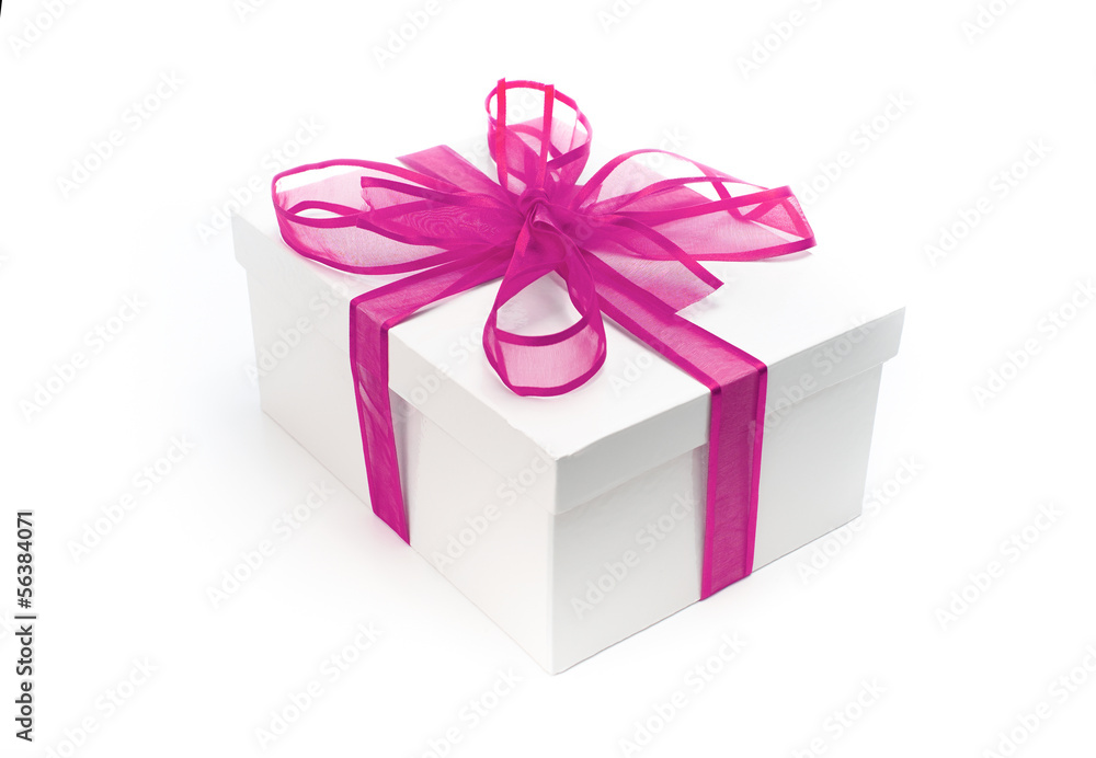 Christmas present wrapped with a pink ribbon and bow. Christmas present wrapped with a pink ribbon and bow.