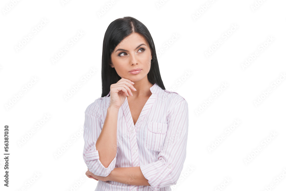 Thoughtful woman. Confident young woman holding hand on chin and Thoughtful woman. Confident young woman holding hand on chin and