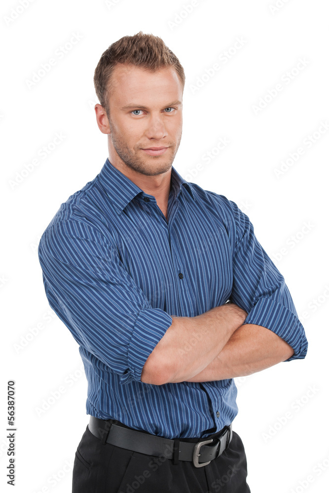 Confident man. Confident young man keeping arms crossed and smil Confident man. Confident young man keeping arms crossed and smil