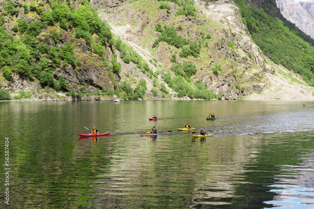 Group of people in kayaks floating in the Sognefjord