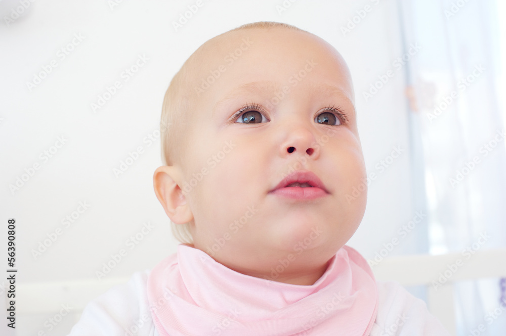 Portrait of an adorable baby against white background