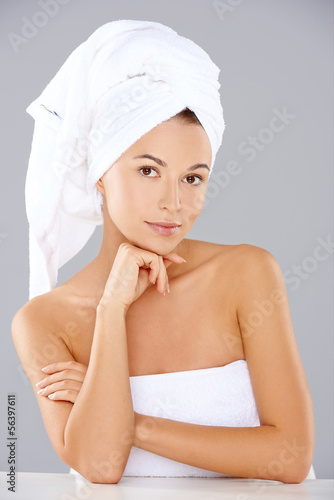 Beautiful serene woman wearing white towels