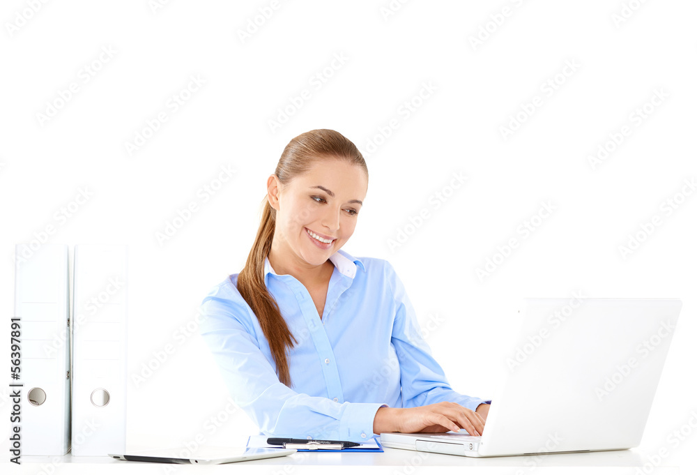 Smiling businesswoman working on a laptop Smiling businesswoman working on a laptop