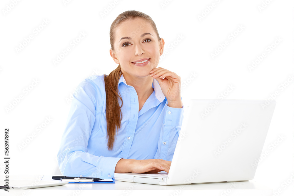 Smiling businesswoman working on a laptop Smiling businesswoman working on a laptop