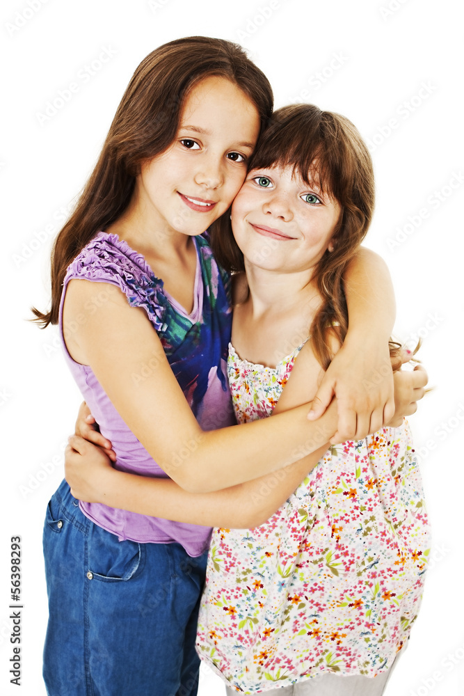 Sisters hugging. Isolated on white background Sisters hugging. Isolated on white background