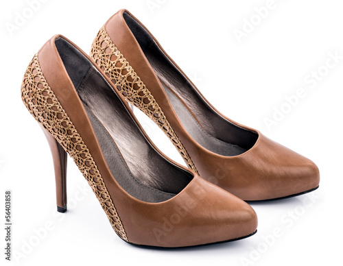 An elegant pair of woman's brown shoes on a white background.