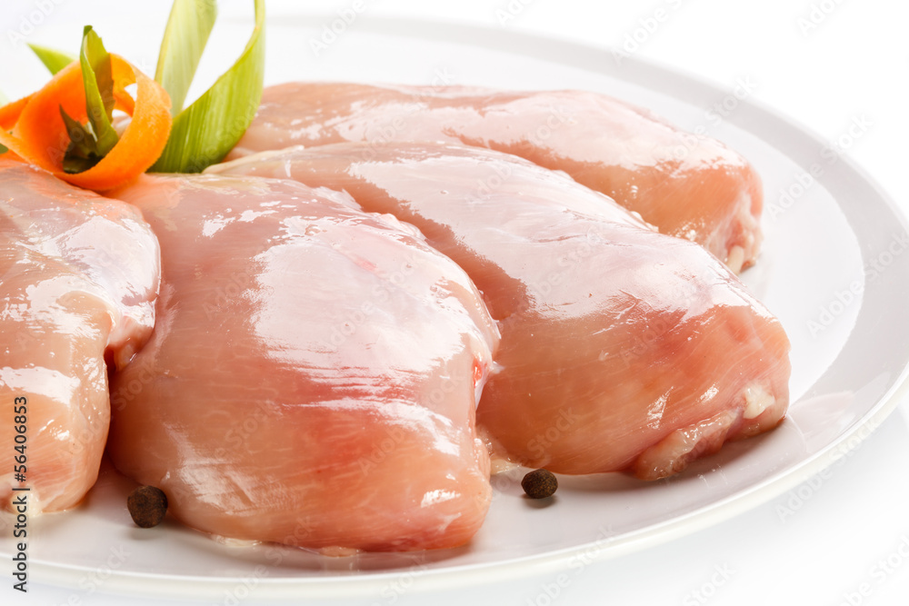 Raw chicken breasts on white background Raw chicken breasts on white background