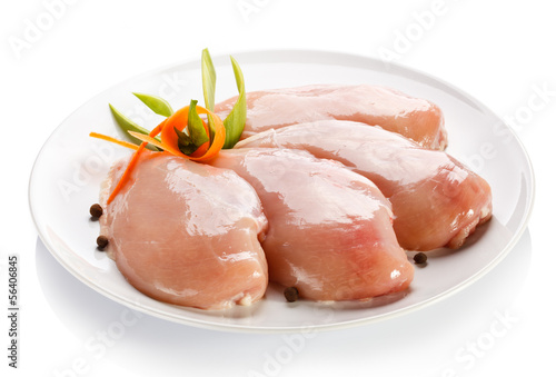 Raw chicken breasts on white background