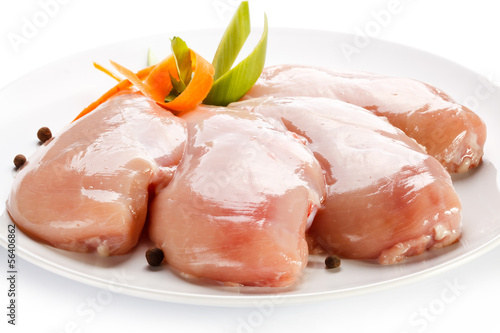 Raw chicken breasts on white background