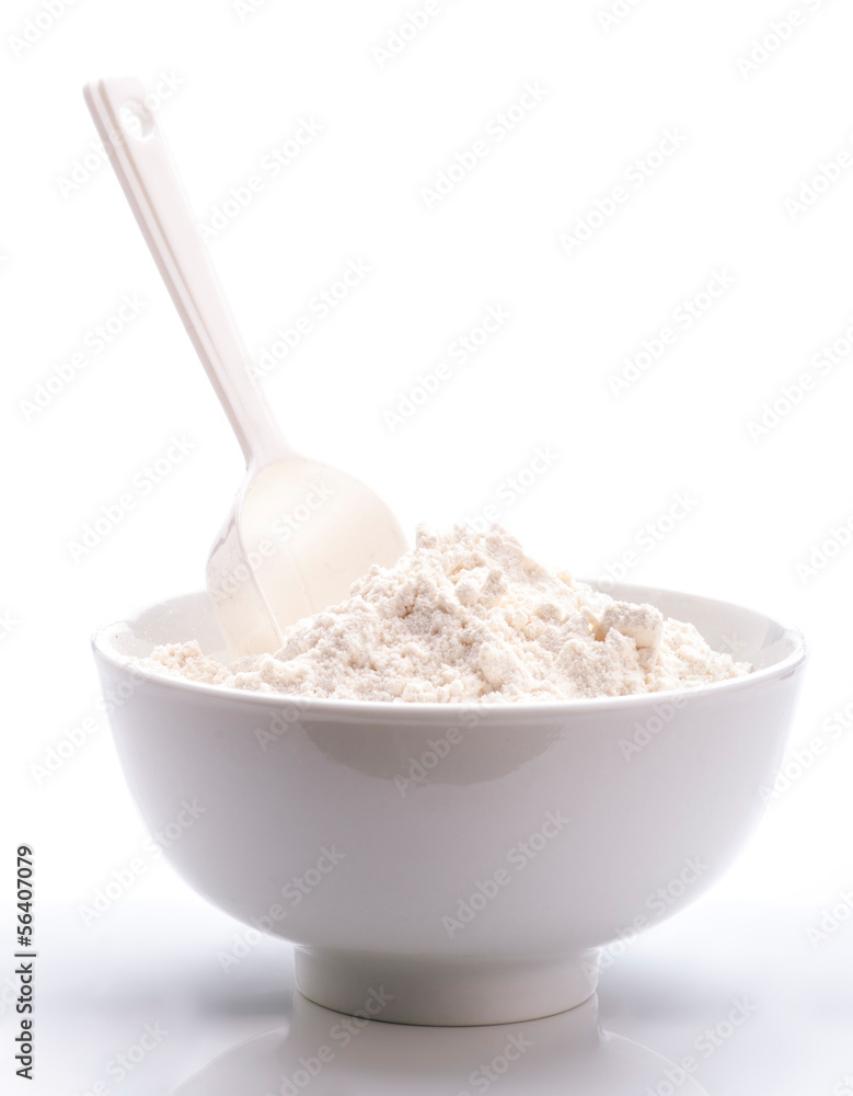porcelain white bowl with spoon full of flour porcelain white bowl with spoon full of flour