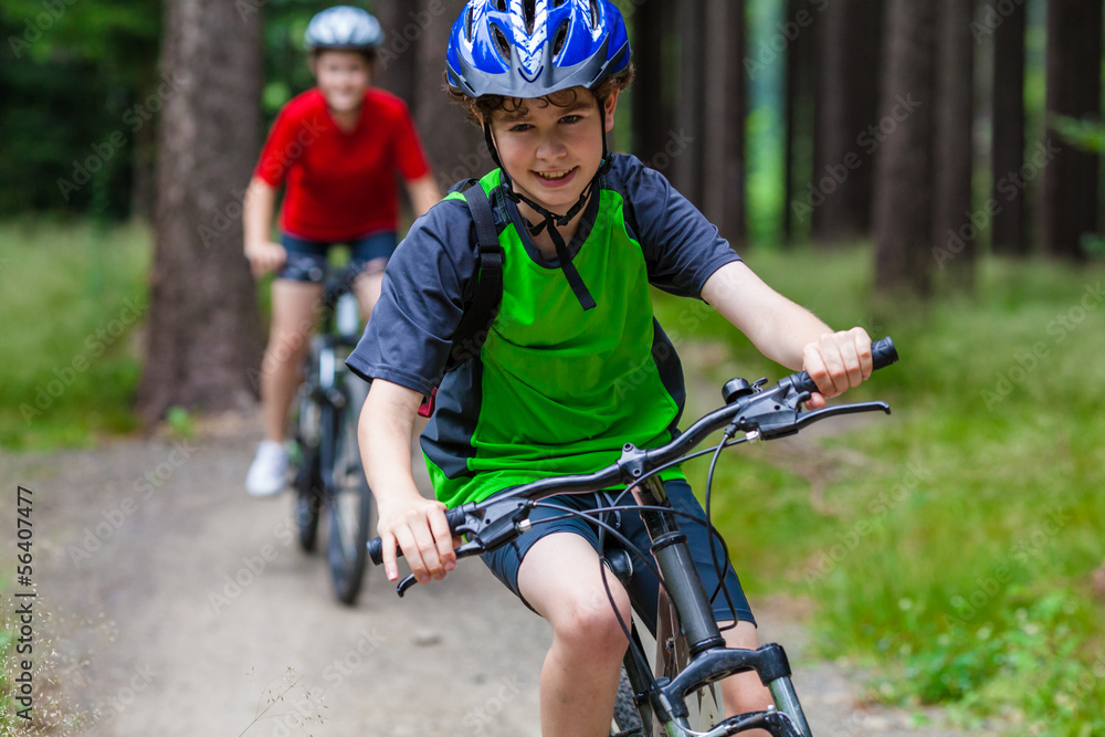 Fototapeta premium Healthy lifestyle - teenage girl and boy biking