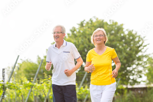 Seniors running in the nature doing sport