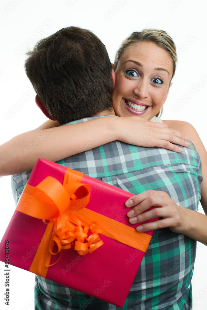 young casual couple with gift young casual couple with gift