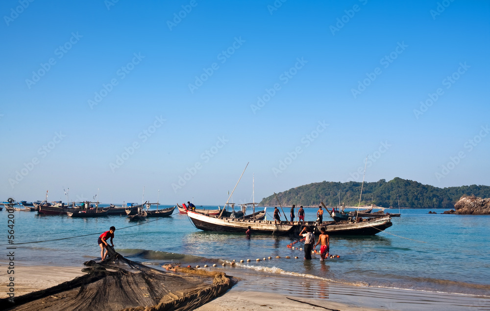 Fishermen with nets at Ngapali beach, Myanmar