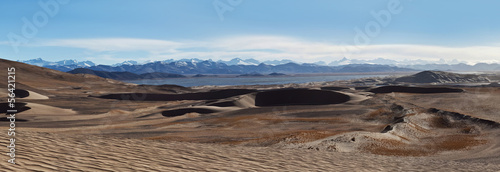 Panorama of sand dunes and Himalayas in Tibet