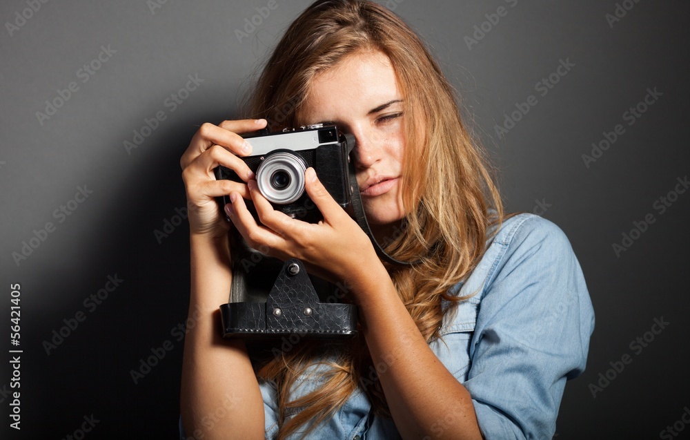 Sexy photographer woman with old camera Sexy photographer woman with old camera