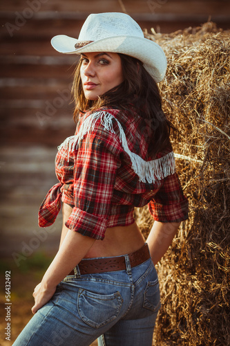 young adult woman posing on farmland