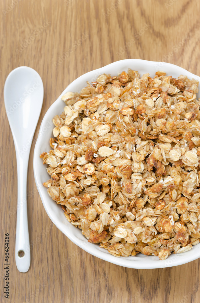 homemade muesli in a bowl and spoon close-up top view homemade muesli in a bowl and spoon close-up top view