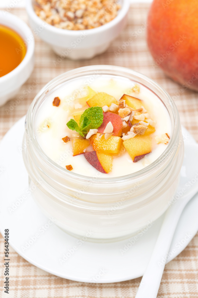 homemade yogurt with honey, peaches and nuts, top view homemade yogurt with honey, peaches and nuts, top view