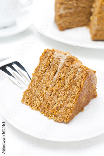 piece of honey cake on a white plate