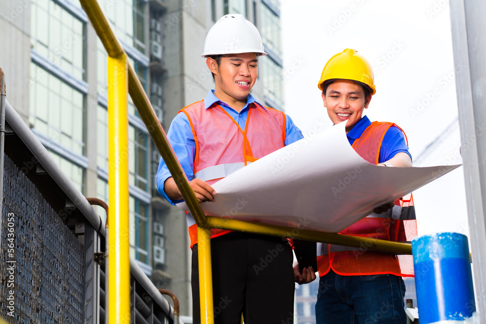 Architect and supervisor on construction site