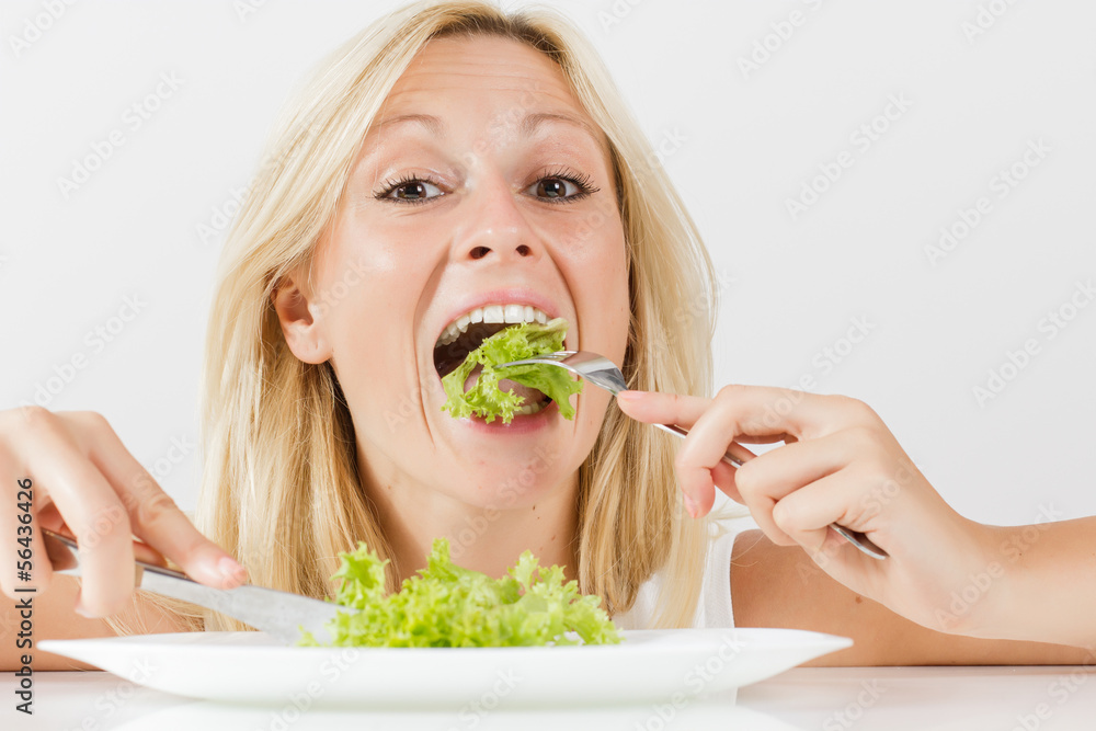 vegetarian woman eating green salad vegetarian woman eating green salad